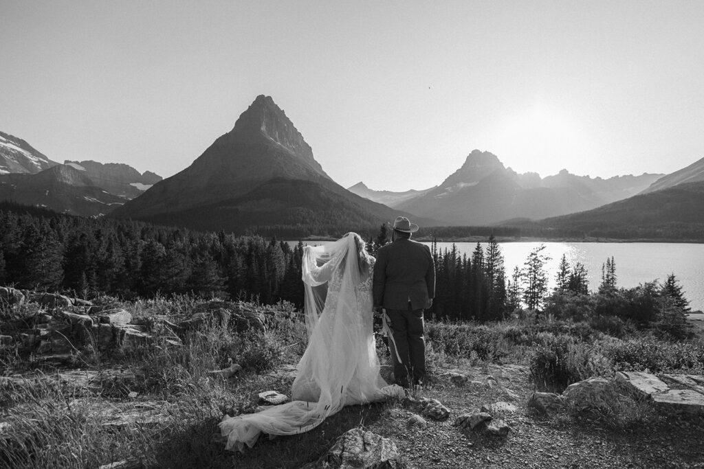 couple posing for their glacier national park elopement
