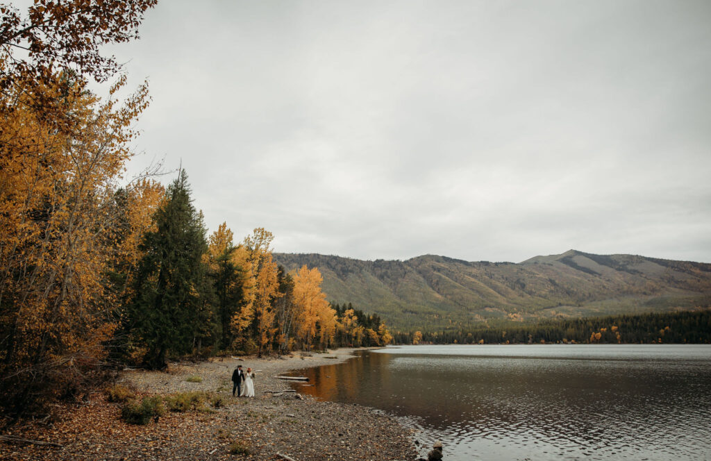 A couple capturing their elopement memories in Glacier National Park, Montana, with a backdrop of rugged beauty and wide-open spaces.
