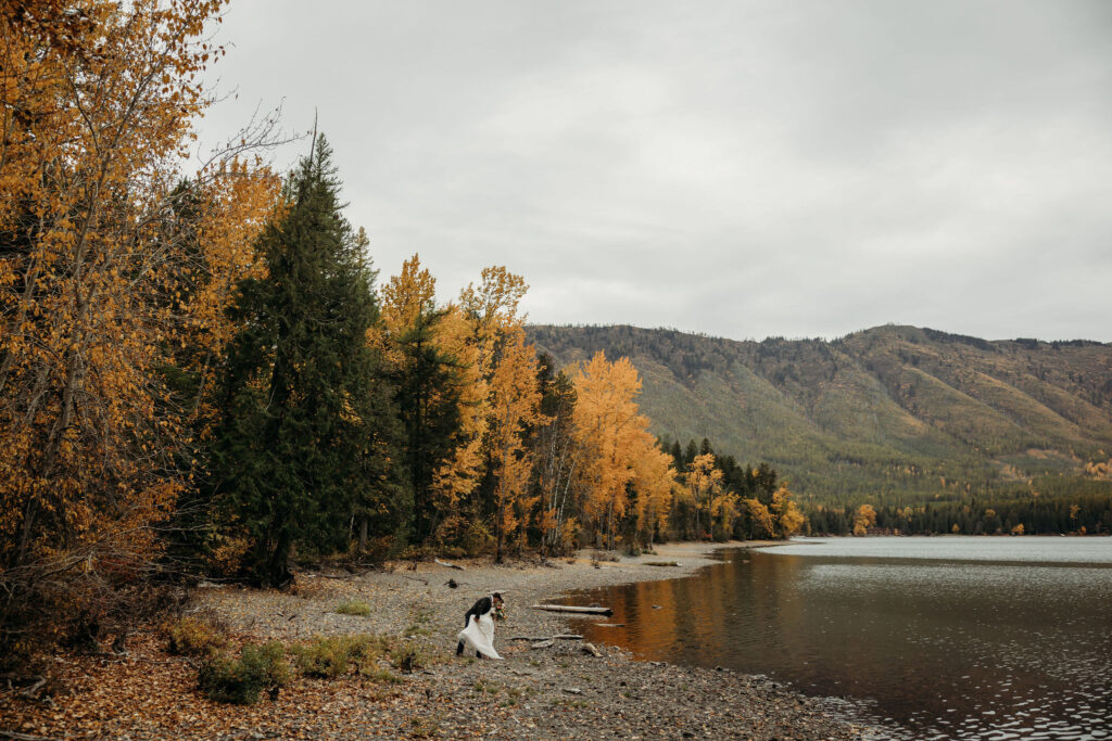 A couple capturing their elopement memories in Glacier National Park, Montana, with a backdrop of rugged beauty and wide-open spaces.
