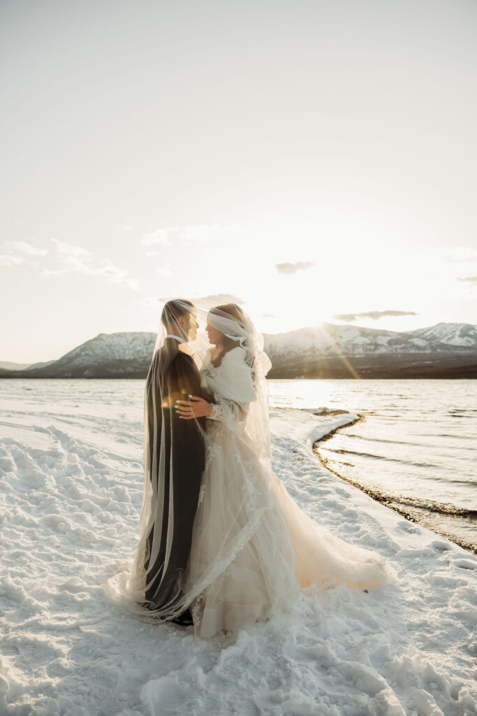 Two lovebirds embracing the adventure of their elopement, posing in the scenic surroundings of Glacier National Park, Montana.
