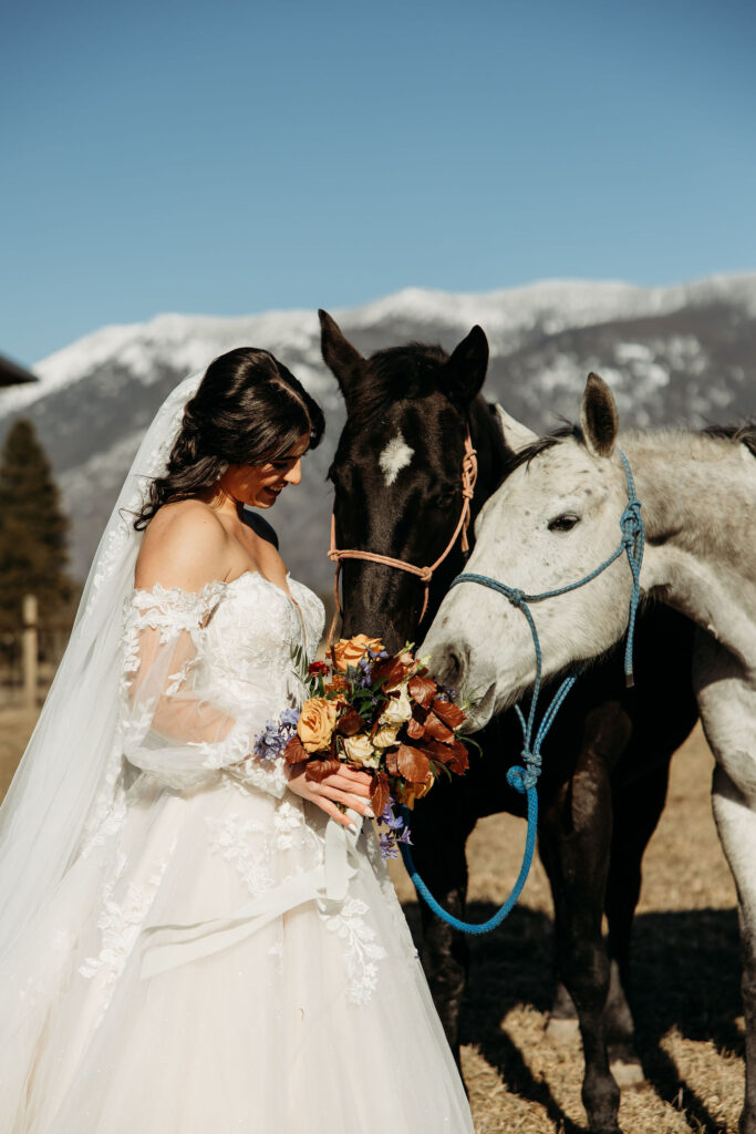 Two lovebirds embracing the adventure of their elopement, posing in the scenic surroundings of Glacier National Park, Montana.