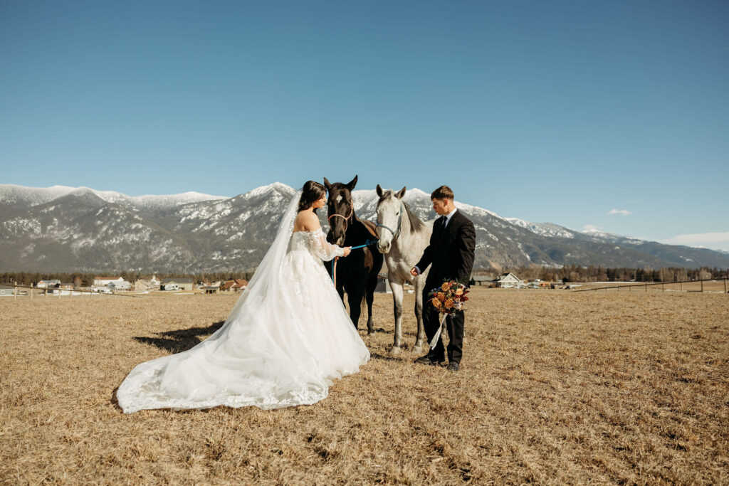 A couple standing together during their adventurous elopement photoshoot in Glacier National Park, Montana, surrounded by stunning natural scenery.
