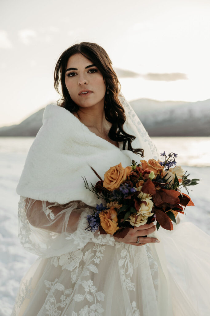 A couple embracing the wild landscapes of Glacier National Park for their elopement photos.
