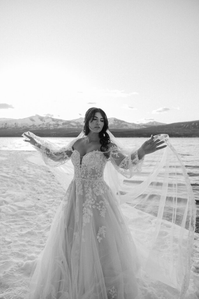 A romantic moment captured as a couple celebrates their elopement in Glacier National Park's rugged beauty.
