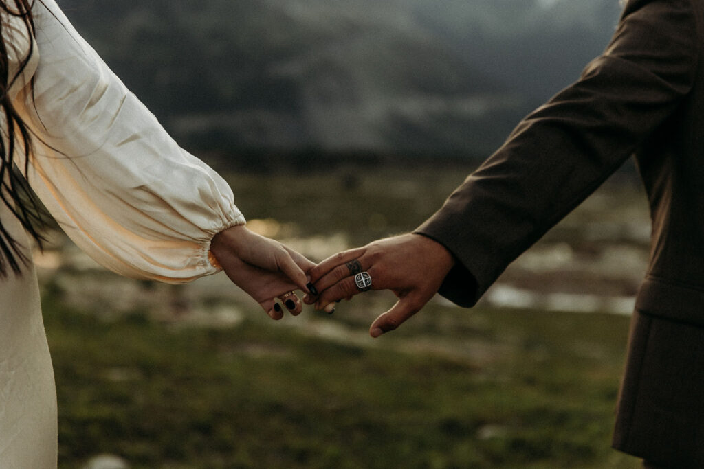 A couple capturing their elopement memories in Glacier National Park, Montana, with a backdrop of rugged beauty and wide-open spaces.
