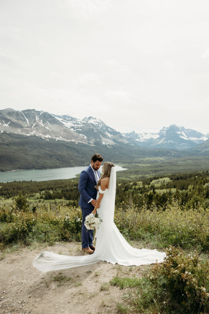 Bride and groom sharing a kiss with mountain views in Montana
