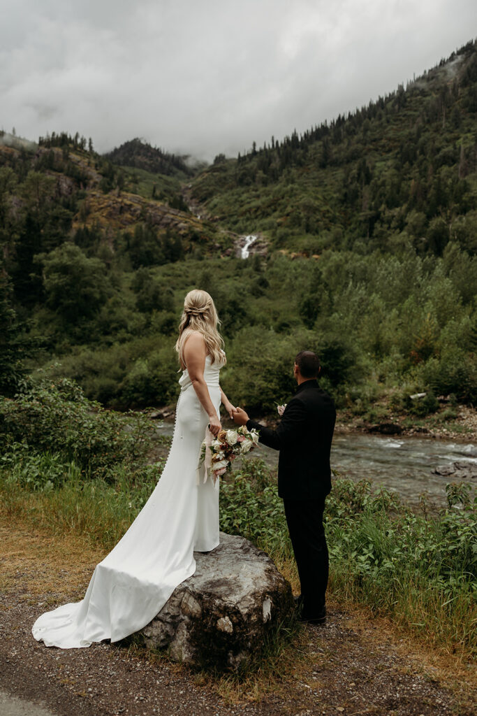 An outdoor wedding photoshoot setup in a scenic Montana meadow
