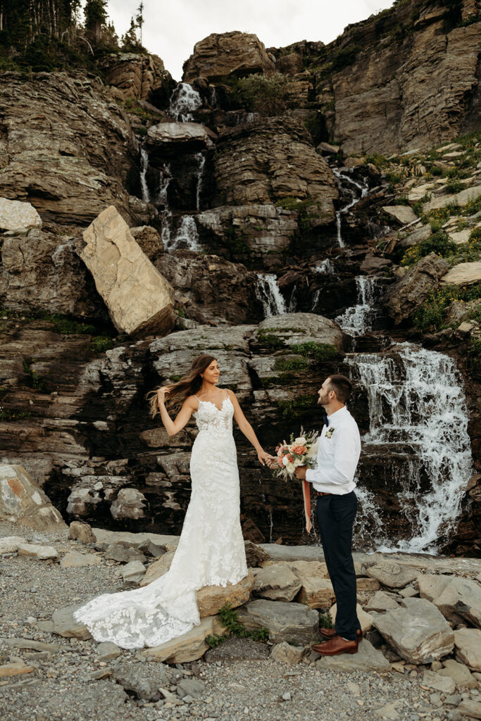 Bride and groom hiking together during their epic elopement
