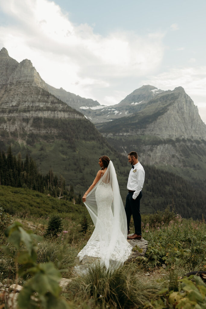 Bride and groom hiking together during their epic elopement
