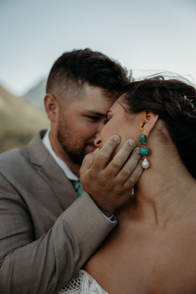 Bride and groom hiking together during their epic elopement
