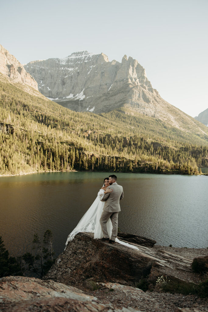 Bride and groom hiking together during their epic elopement

