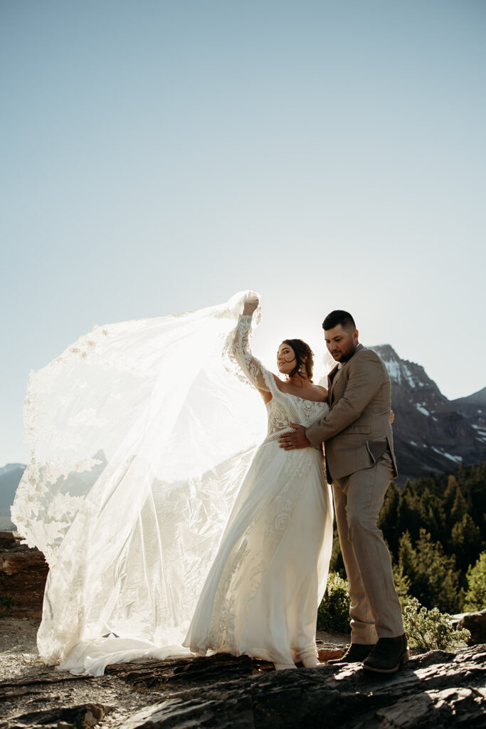 Bride and groom hiking together during their epic elopement

