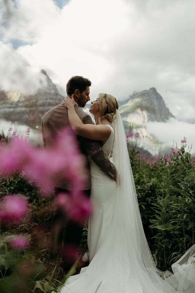 Bride and groom hiking together during their epic elopement
