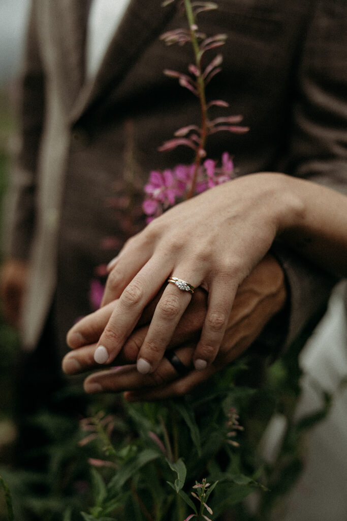 Couple eloping in Glacier National Park with mountain views in the background