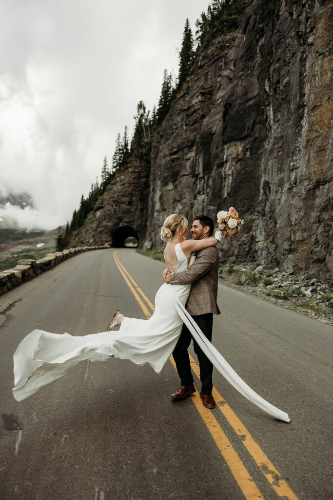Couple eloping in Glacier National Park with mountain views in the background
