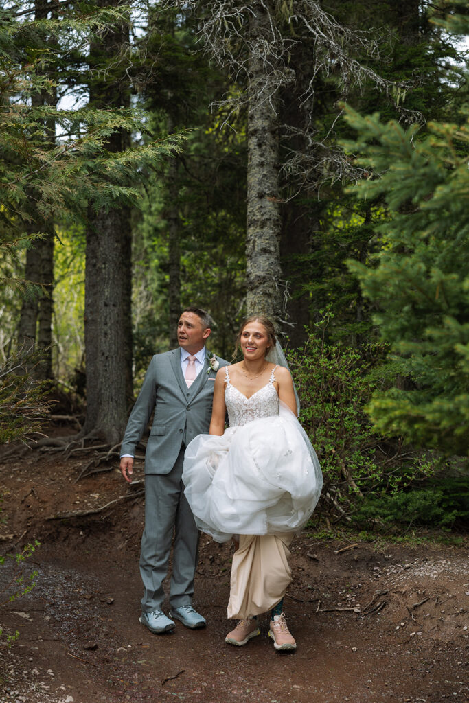 Bride and groom exploring the trails and natural beauty of Avalanche Lake
