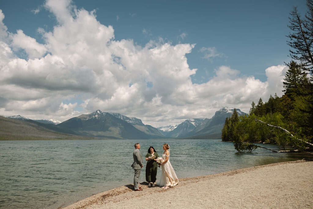 Couple sharing a candid moment during their adventure elopement in Glacier National Park

