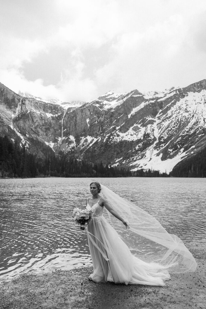 Couple sharing a candid moment during their adventure elopement in Glacier National Park
