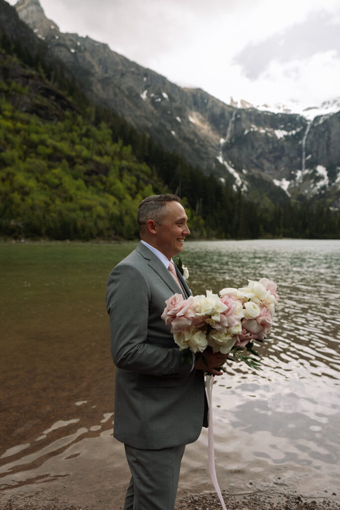 Couple sharing a candid moment during their adventure elopement in Glacier National Park
