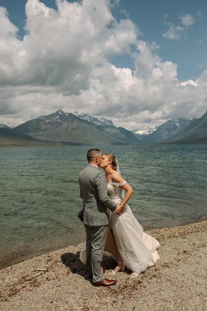 Couple sharing a candid moment during their adventure elopement in Glacier National Park

