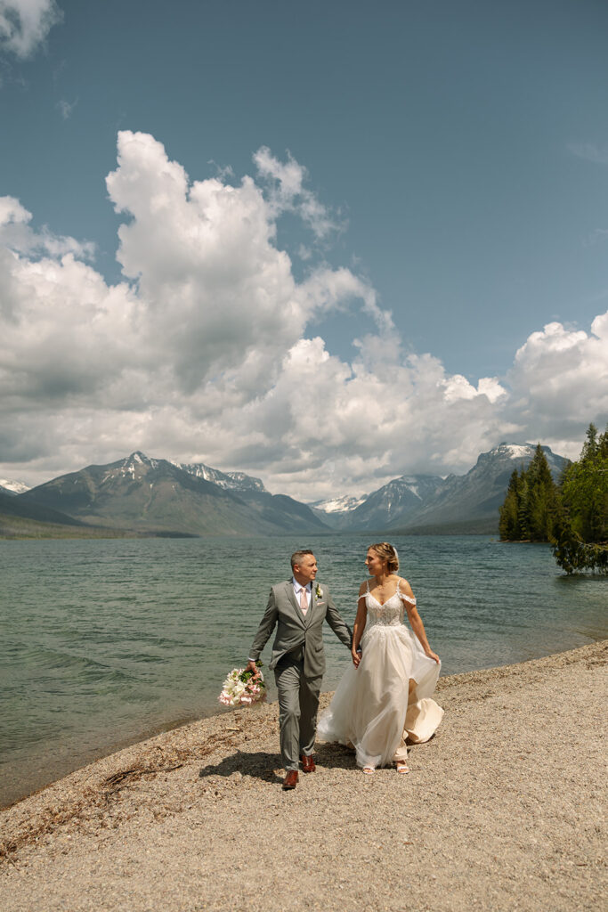 Couple sharing a candid moment during their adventure elopement in Glacier National Park
