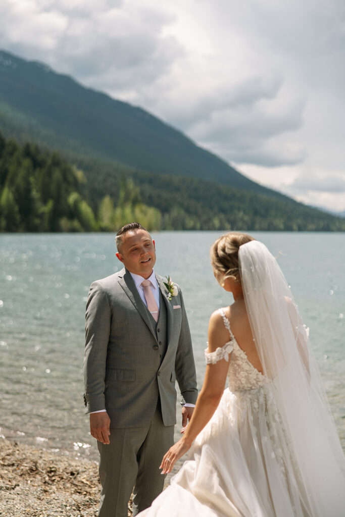 Couple sharing a candid moment during their adventure elopement in Glacier National Park
