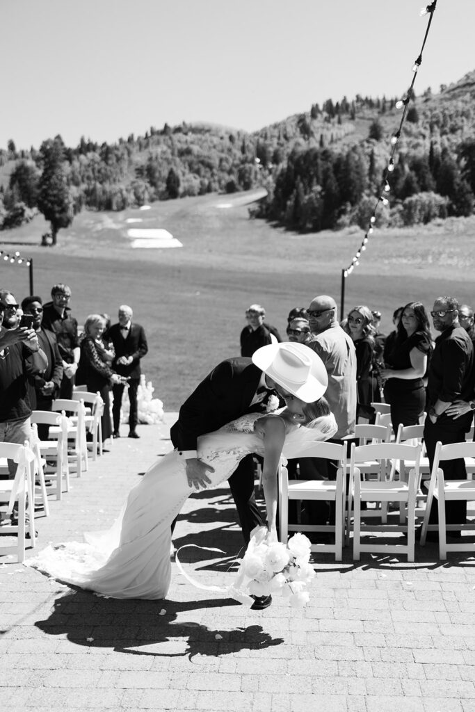 Timeless wedding moment captured in the mountains with elegant western details.
