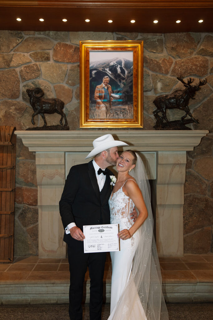 Timeless wedding moment captured in the mountains with elegant western details.
