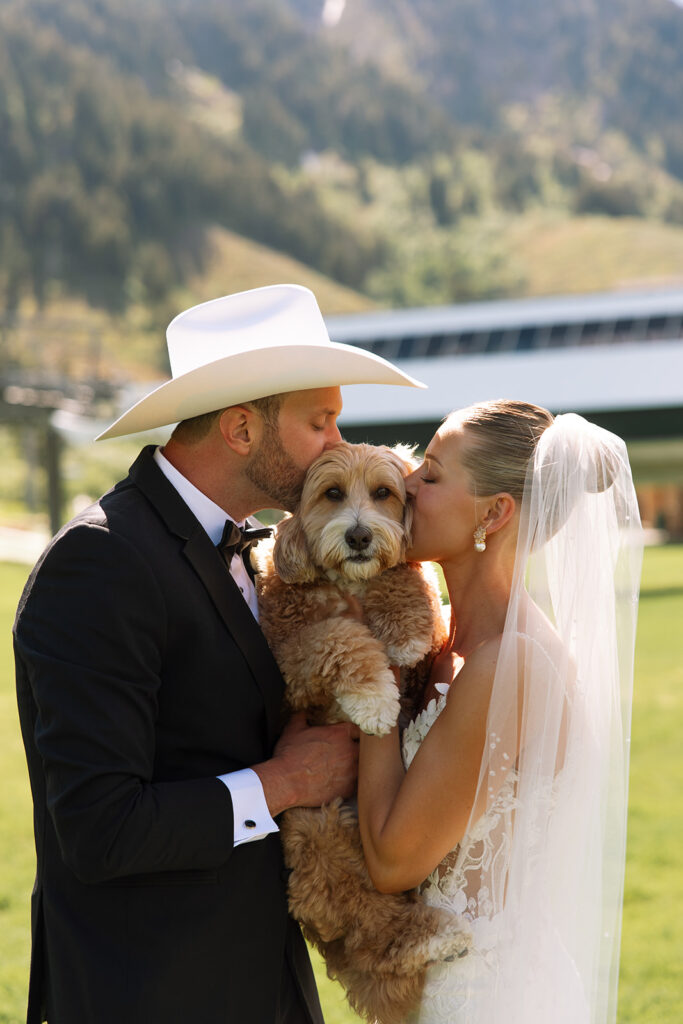Bride and groom sharing a candid moment during their upscale western wedding celebration.
