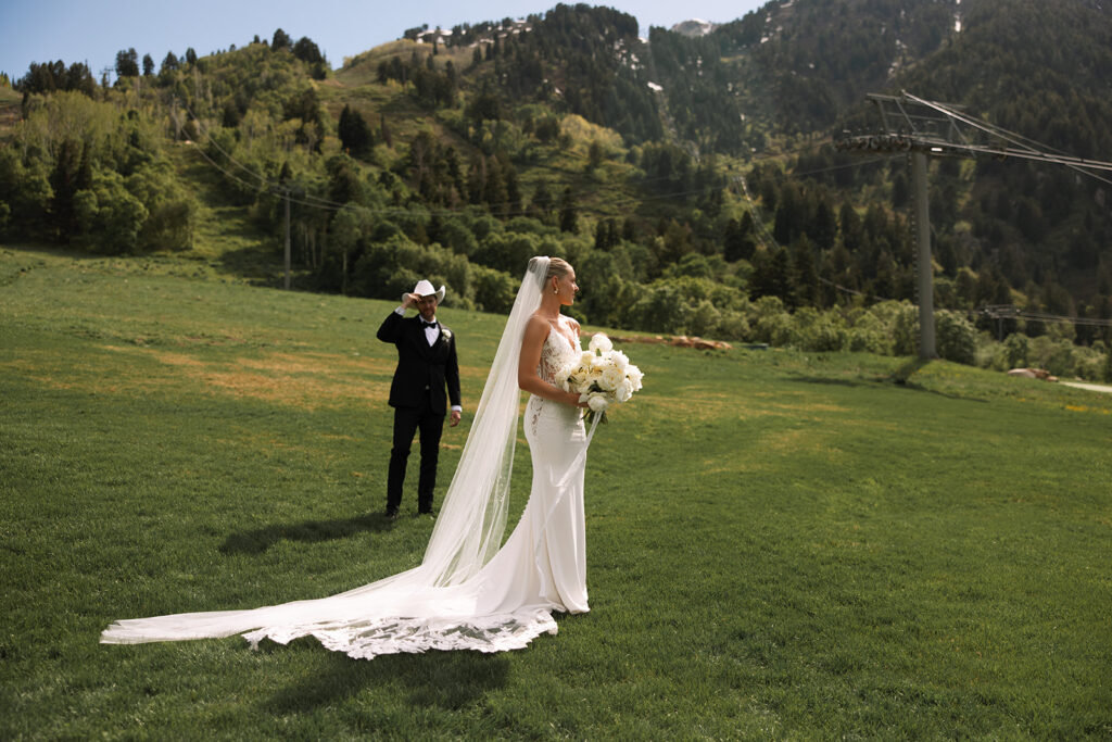 Bride and groom sharing a candid moment during their upscale western wedding celebration.
