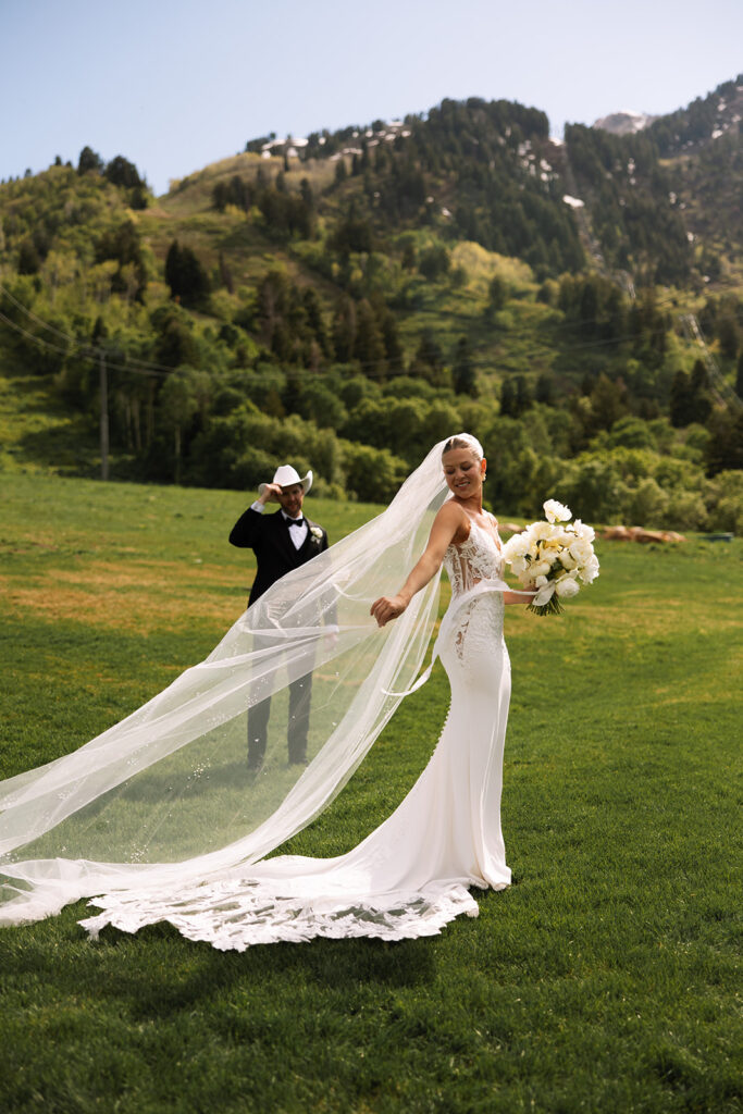 Bride and groom sharing a candid moment during their upscale western wedding celebration.