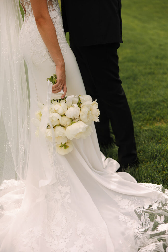 Timeless wedding moment captured in the mountains with elegant western details.
