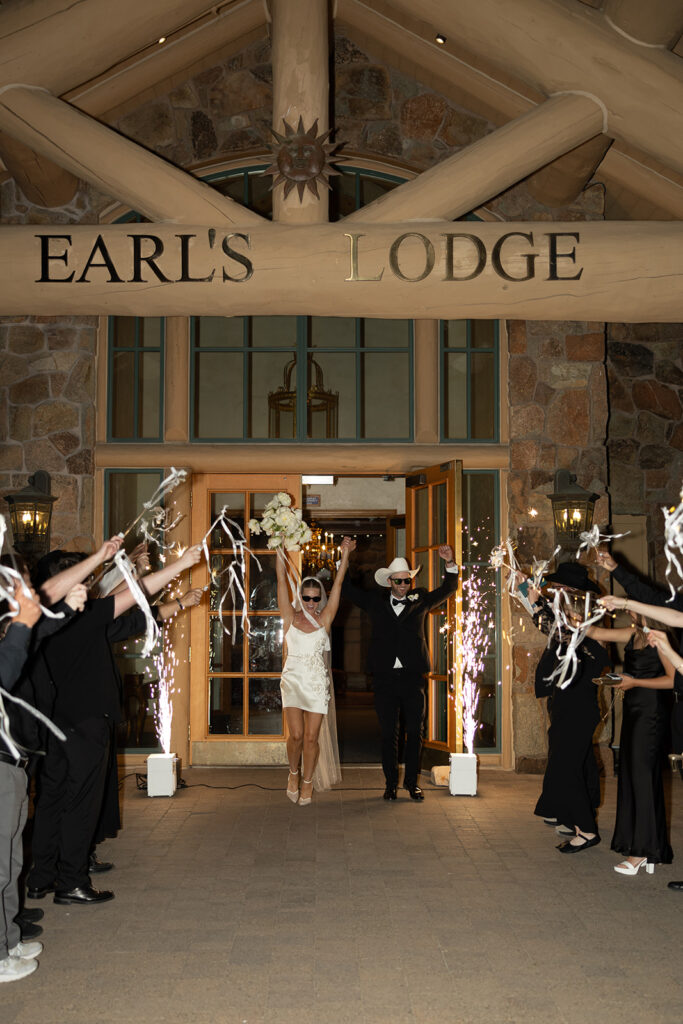 Bride and groom sharing a candid moment during their upscale western wedding celebration.
