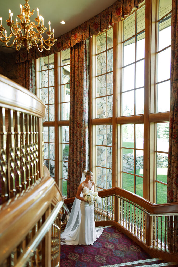 A couple celebrating their luxury western wedding with mountain views in the background.
