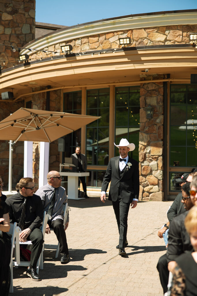 A couple celebrating their luxury western wedding with mountain views in the background.

