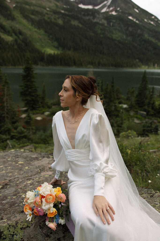 Bride and groom sharing a quiet moment during their Many Glacier elopement.
