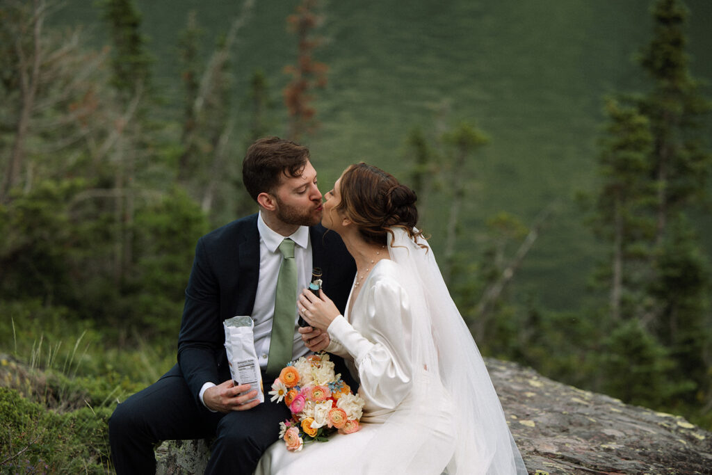 Newlyweds celebrating with champagne and cookies after their ceremony.
