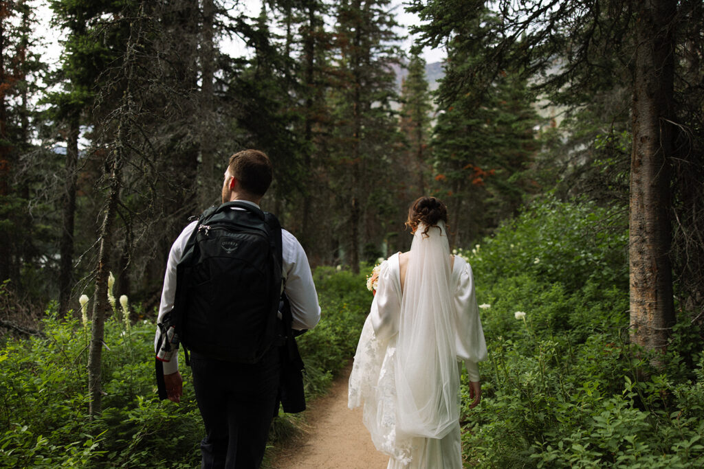 Bride and groom sharing a quiet moment during their Many Glacier elopement.
