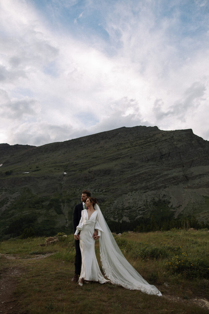 Bride and groom sharing a quiet moment during their Many Glacier elopement.
