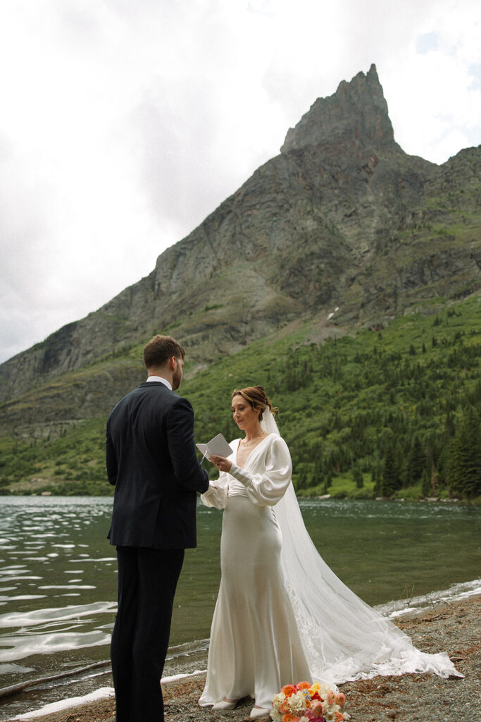 Bride and groom sharing a quiet moment during their Many Glacier elopement.
