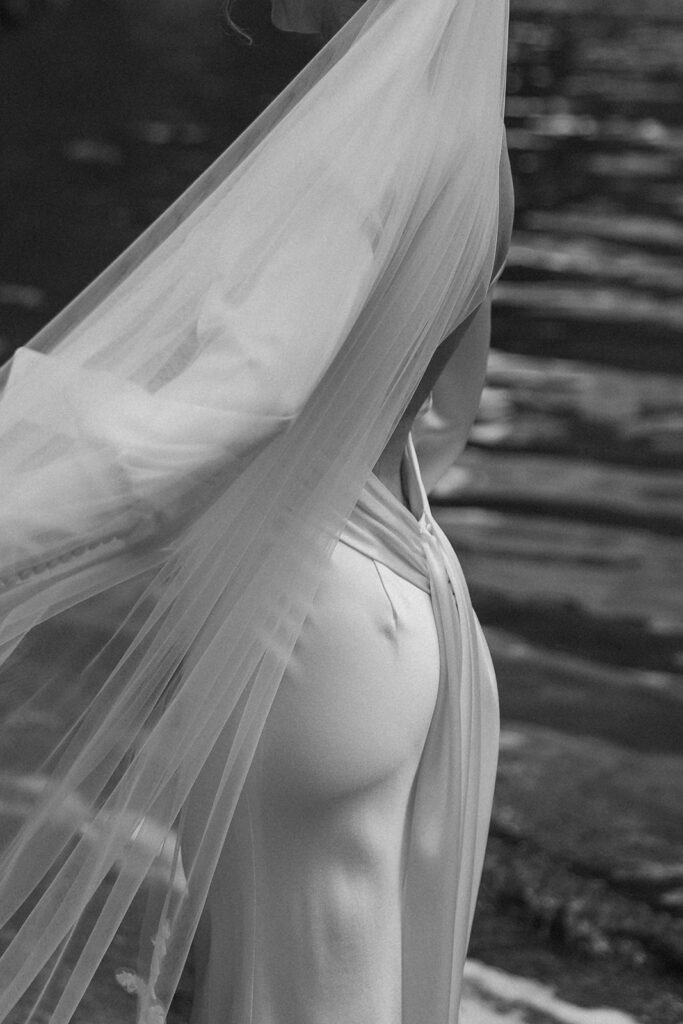 Bride and groom sharing a quiet moment during their Many Glacier elopement.
