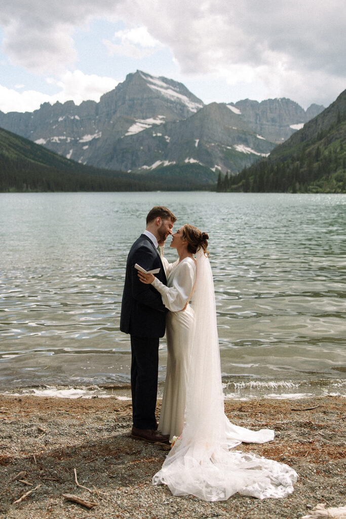 Bride and groom sharing a quiet moment during their Many Glacier elopement.
