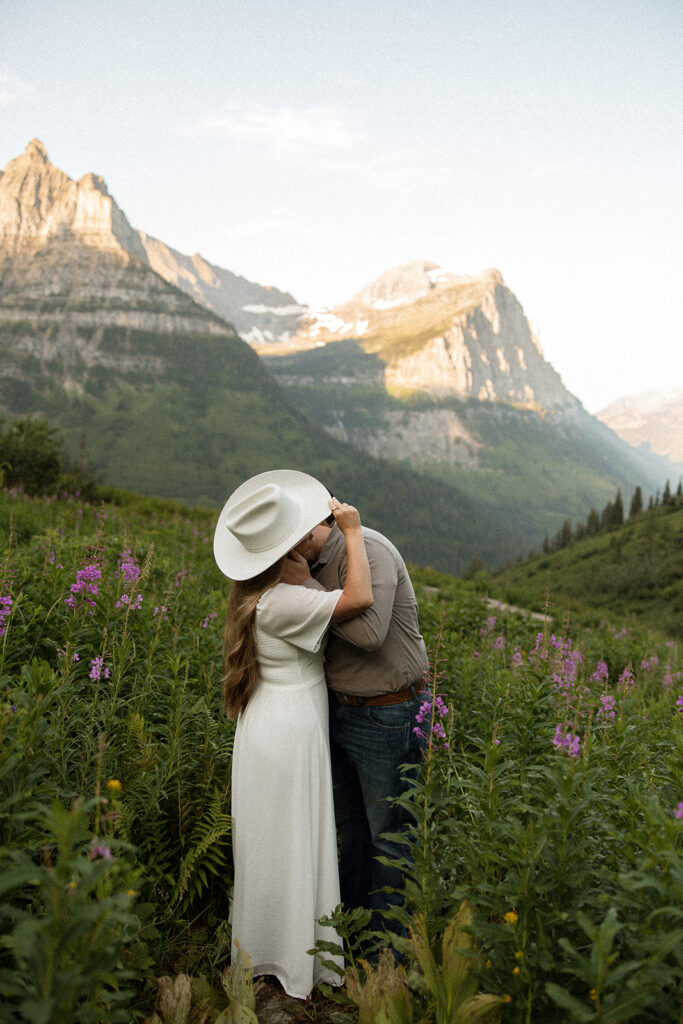 Engagement adventure session capturing a couple enjoying the morning light in Glacier National Park.