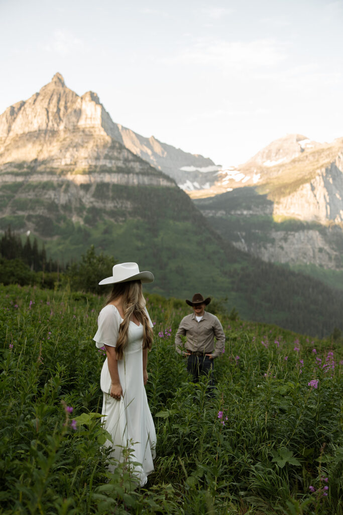 Engagement adventure session capturing a couple enjoying the morning light in Glacier National Park.