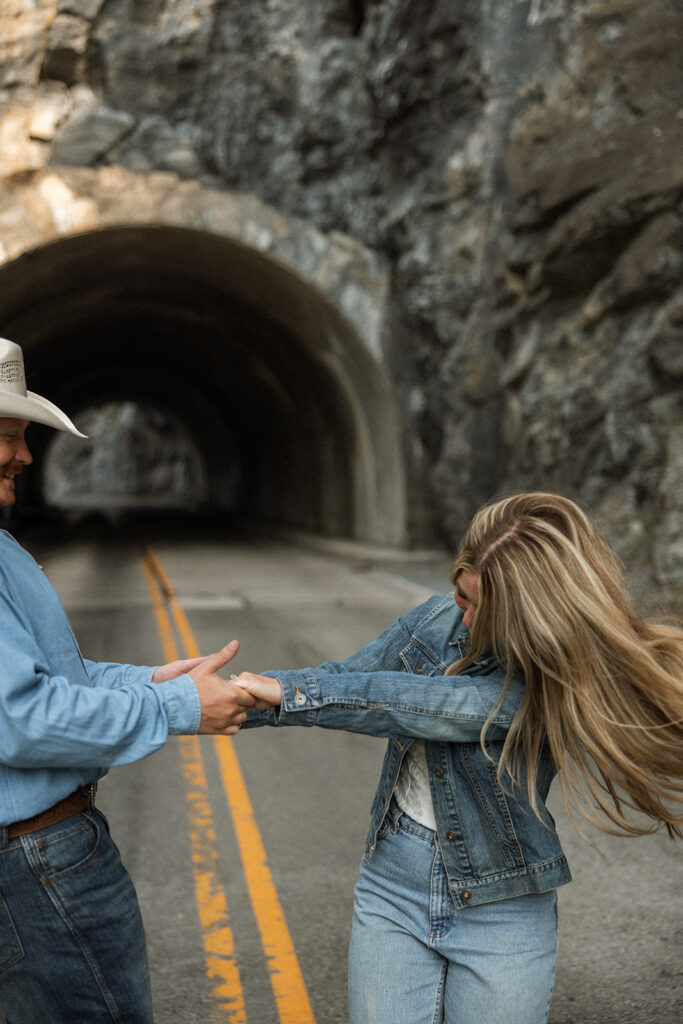 Playful engagement session with Olivia and Alex exploring the mountains at sunrise.
