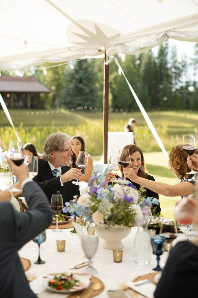 Guests enjoying the reception at an outdoor ranch wedding in Montana
