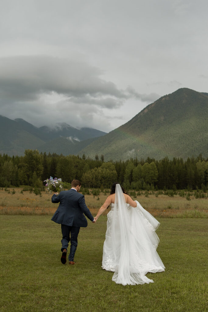 Bride and groom sharing a candid moment during their Montana wedding day
