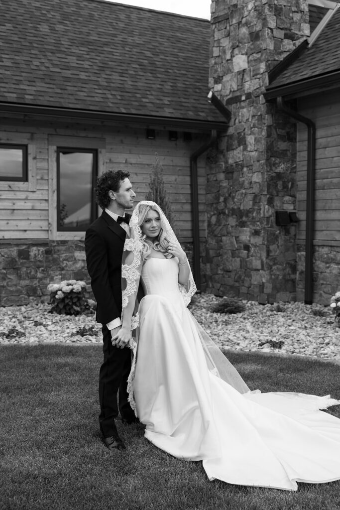 Bride and groom sharing a quiet moment surrounded by Montana mountain views.
