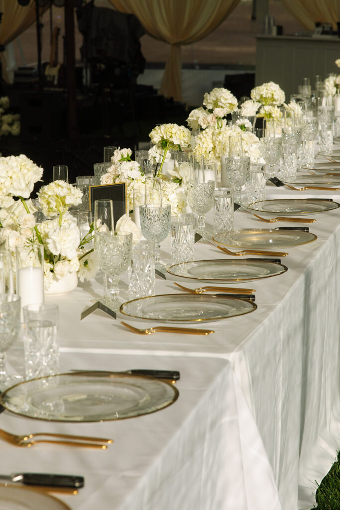 Intimate wedding reception at a rustic Montana lodge under string lights.
