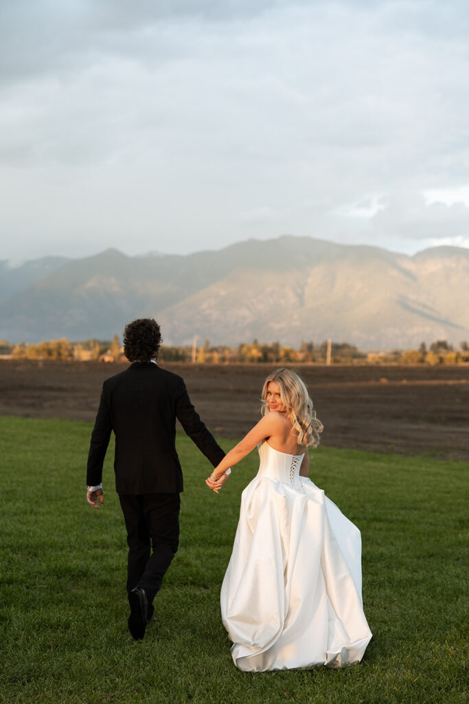 Bride and groom sharing a quiet moment surrounded by Montana mountain views.
